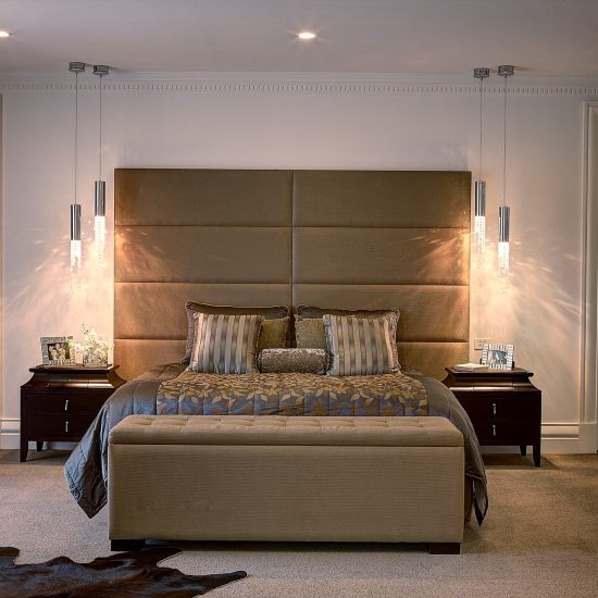 master bedroom, bedroom decorating, upholstered bedhead, custom bedhead, panelled bedhead, bedside tables, Italian bedside tables, pendant lights, pendant lights beside bed, pendant lights over bedside table, lights over bedsides, pendants over bedsides, bed box, blanket box, custom bedding, silk bedding, cowhide, brown cowhide