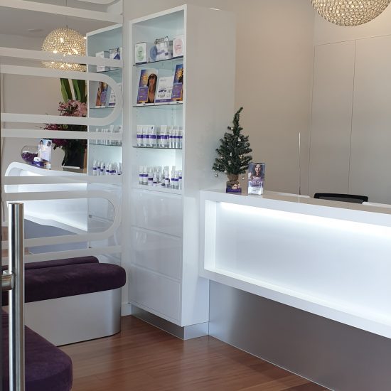 Custom joinery, 2 pac finish, white 2 pac, retail design, commercial design, backlit shelving, reception desk design, cabinet design, bench seating, custom bench seating, product display, mirror wall panel