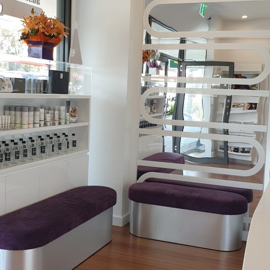 Custom joinery, 2 pac finish, white 2 pac, retail design, commercial design, backlit shelving, cabinet design, bench seating, custom bench seating, product display, mirror wall panel