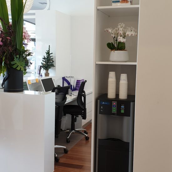 Custom joinery, 2 pac finish, white 2 pac, retail design, commercial design, reception desk design, cabinet design, water filter