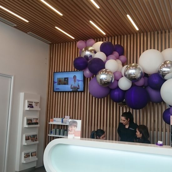 Custom joinery, 2 pac finish, white 2 pac, retail design, commercial design, reception desk design, cabinet design, product display, timber strip panelling, timber feature