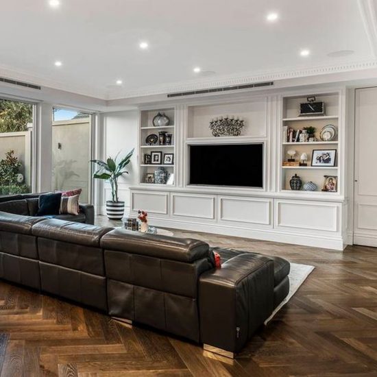 custom joinery, entertainment joinery, door mouldings, family room decorating, timber floor, herringbone flooring, TV room, leather sofa