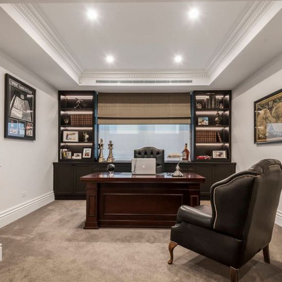 home office, study, wing chair, backlit shelves, custom joinery, recessed ceiling