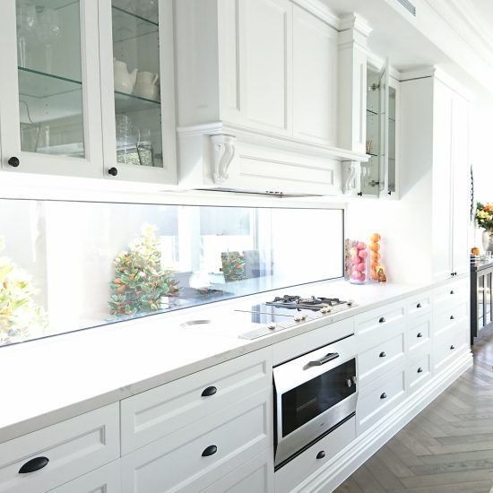 kitchen design, classic kitchen, formal kitchen, Hamptons kitchen, timber floor, herringbone flooring, glass cabinet doors, shaker cabinet doors, shaker cabinet drawers, cup pull handles, decorative rangehood canopy