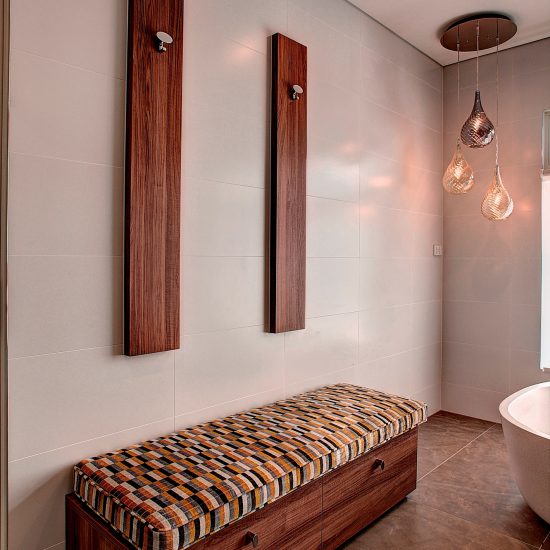 bathroom design, custom joinery, timber veneer panels, luxury bathroom, contemporary bathroom, bench seat, upholstered bench seat, towel storage box, pendant lighting, bathroom lighting