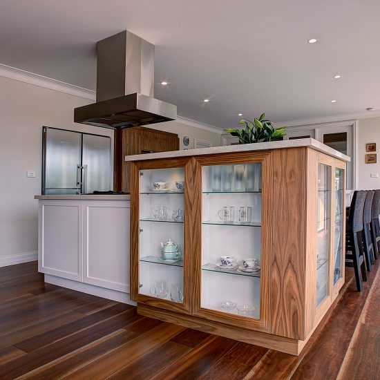 Kitchen design, timber veneer cabinets, glass cabinet doors, floating rangehood, exposed rangehood