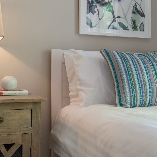 Hamptons style, Hamptons bedroom, white timber bed, timber bedside cabinet, wall art