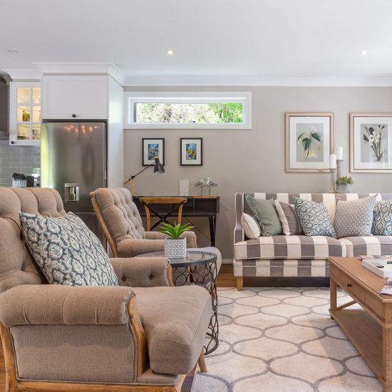 Hamptons style, Hamptons lounge room, striped sofa, timber coffee table, floor rug, diamond patterned rug